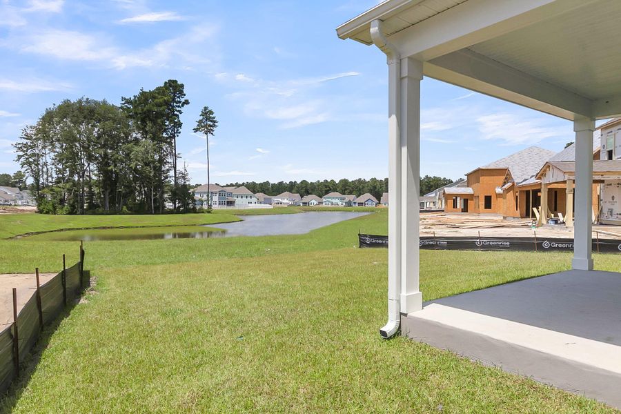 Front exterior of a new home in Tidewater at Lakes of Cane Bay, Summerville, SC, highlighting curb appeal (Image 23).