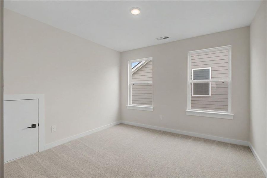 Spacious, unfurnished interior of a new home in The Park at Brighton, Locust Grove (Image 21).