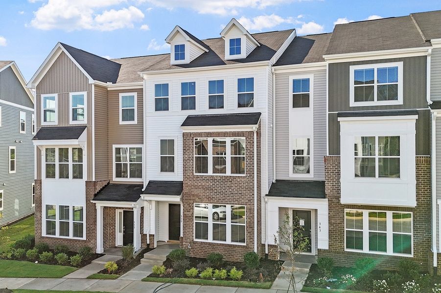Front exterior of a new home in Renaissance at White Oak, Garner, NC, highlighting curb appeal (Image 20). Front exterior of a new home in Renaissance at White Oak, Garner, NC, highlighting curb appeal (Image 20).