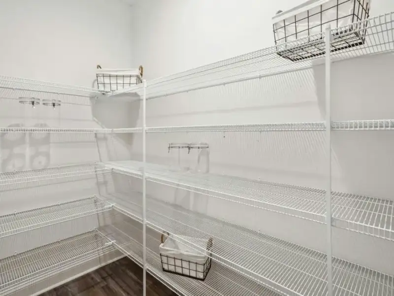 And, a large walk-in pantry provides storage for food and large kitchen appliances - Waylyn by Highland Homes