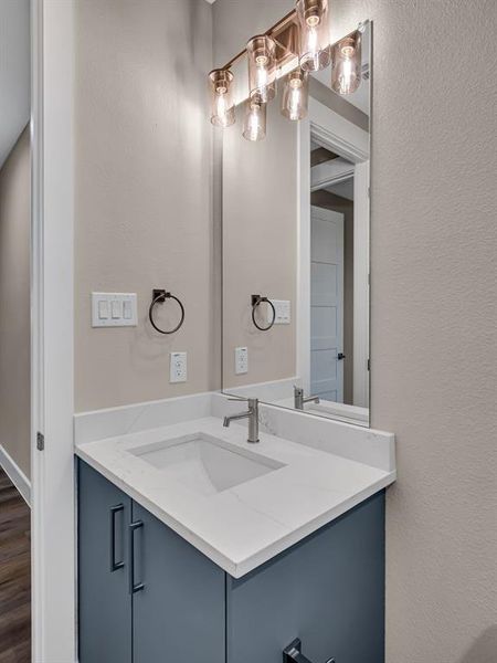 Bathroom with vanity and hardwood / wood-style flooring