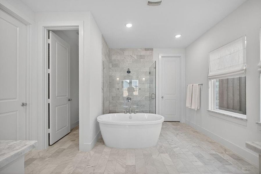 Full bathroom with a stall shower, a freestanding bath, recessed lighting, and vanity Full bathroom with a stall shower, a freestanding bath, recessed lighting, and vanity
