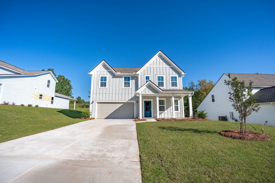 Front exterior of a new home in Carriage Estates, Lexington, SC, highlighting curb appeal (Image 2). Front exterior of a new home in Carriage Estates, Lexington, SC, highlighting curb appeal (Image 2).