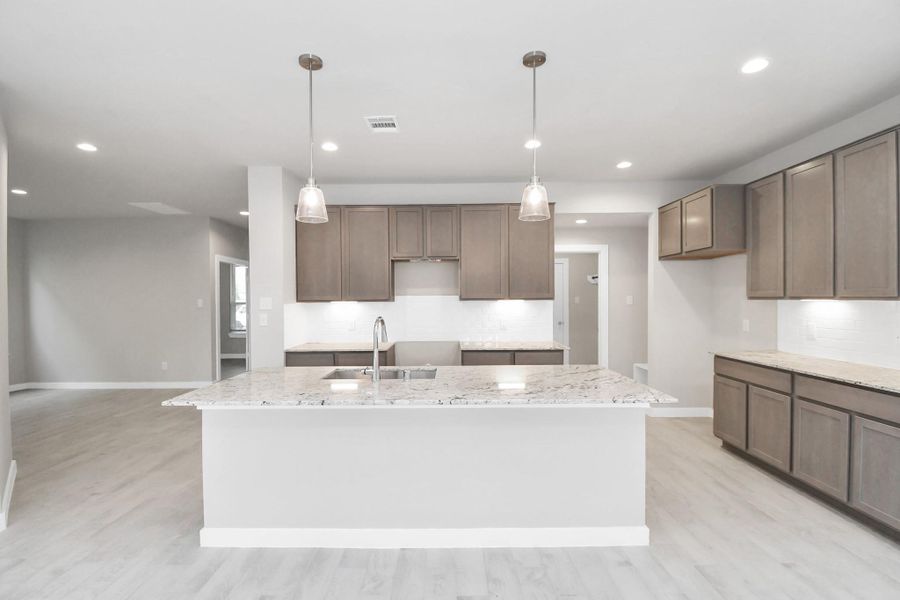 Sample photo of completed home with similar floor plan. Actual colors and selections may vary.