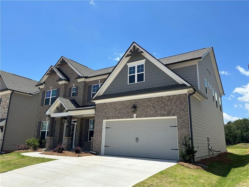Front exterior of a new home in Summerlin, Winder, GA, highlighting curb appeal (Image 2).