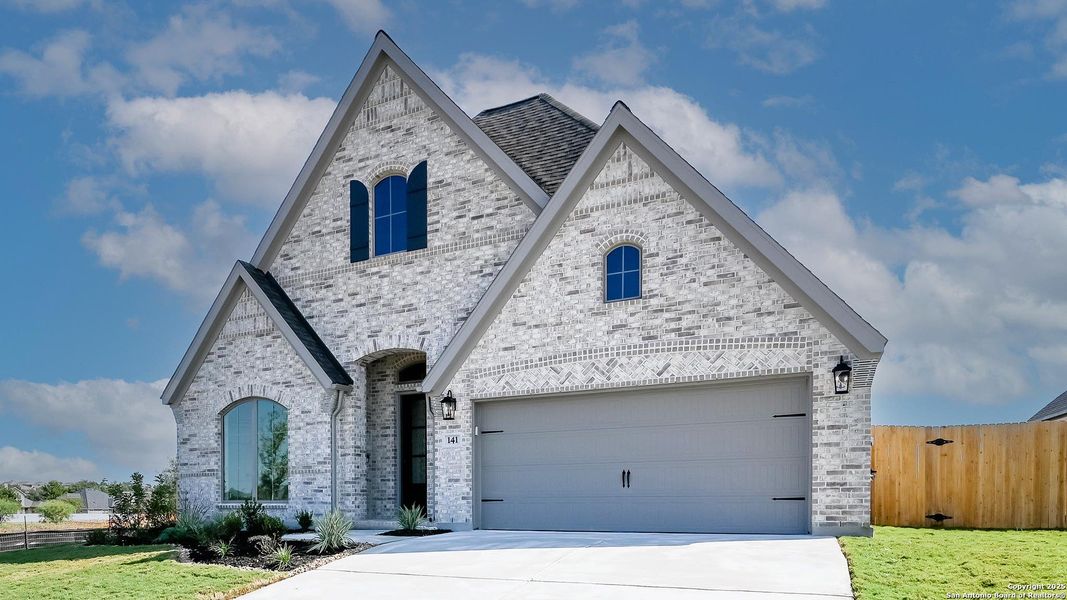Front exterior of a new home in Cibolo Valley Heights 65', Cibolo, TX, highlighting curb appeal (Image 2). Front exterior of a new home in Cibolo Valley Heights 65', Cibolo, TX, highlighting curb appeal (Image 2).