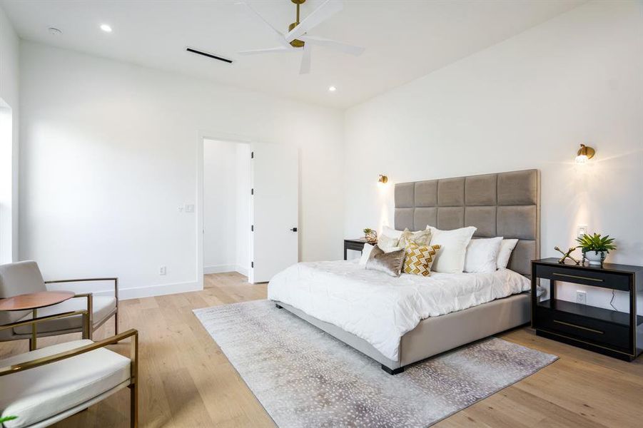 Bedroom featuring ceiling fan and light wood-type flooring