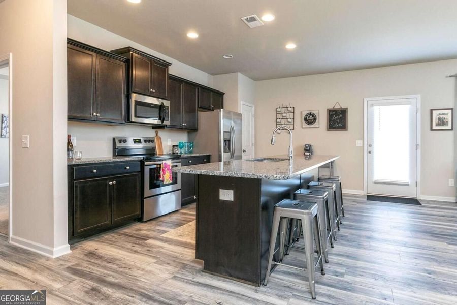 Furnished interior view inside a new home in Cobblestone Crossing Commons, Byron (Image 12).