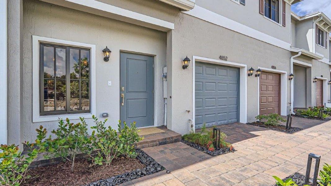Representative exterior photo of a completed home built from the Jade by D.R. Horton in Ashwood Cove, Lake Worth, FL (Image 2). Representative exterior photo of a completed home built from the Jade by D.R. Horton in Ashwood Cove, Lake Worth, FL (Image 2).
