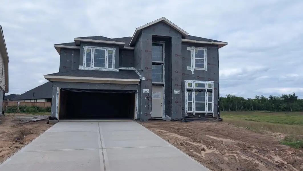 Front exterior of a new home in , Missouri City, TX, highlighting curb appeal (Image 2).