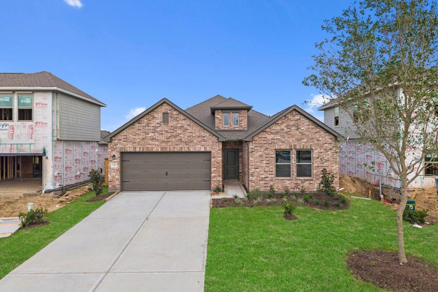 Front exterior of a new home in Windrose Green, Angleton, TX, highlighting curb appeal (Image 21).