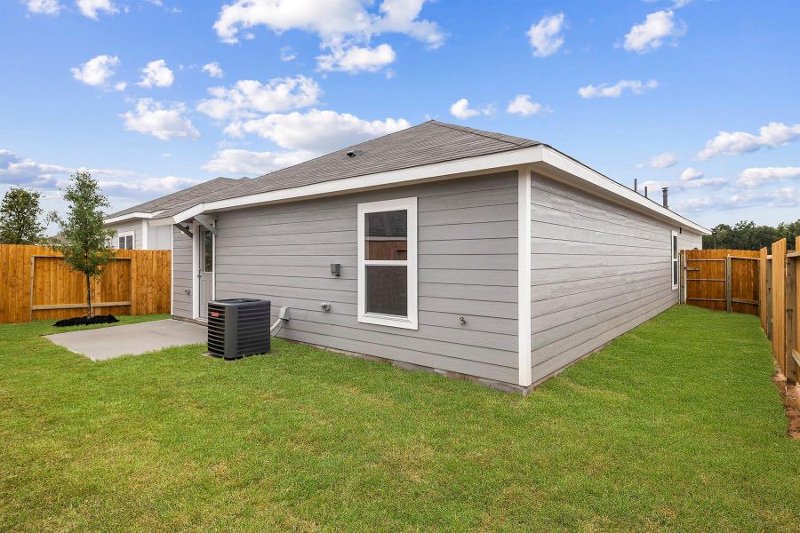 Front exterior of a new home in Magnolia Woods, Magnolia, TX, highlighting curb appeal (Image 1).