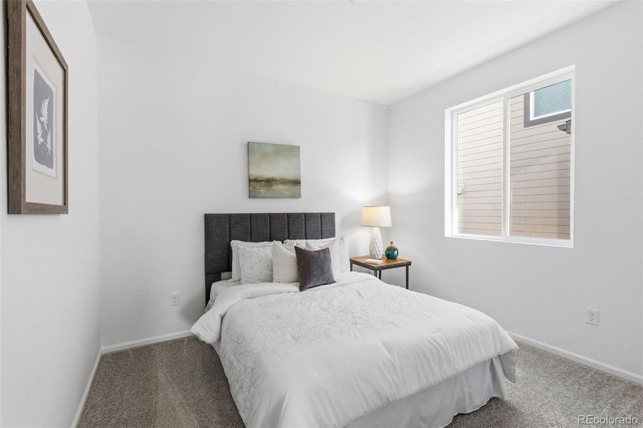 Furnished interior view inside a new home in The Cottages Collection at Ridgeline Vista, Brighton (Image 13).