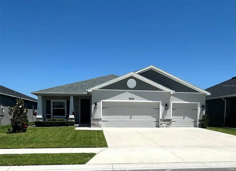 Front exterior of a new home in , Parrish, FL, highlighting curb appeal (Image 1). Front exterior of a new home in , Parrish, FL, highlighting curb appeal (Image 1).