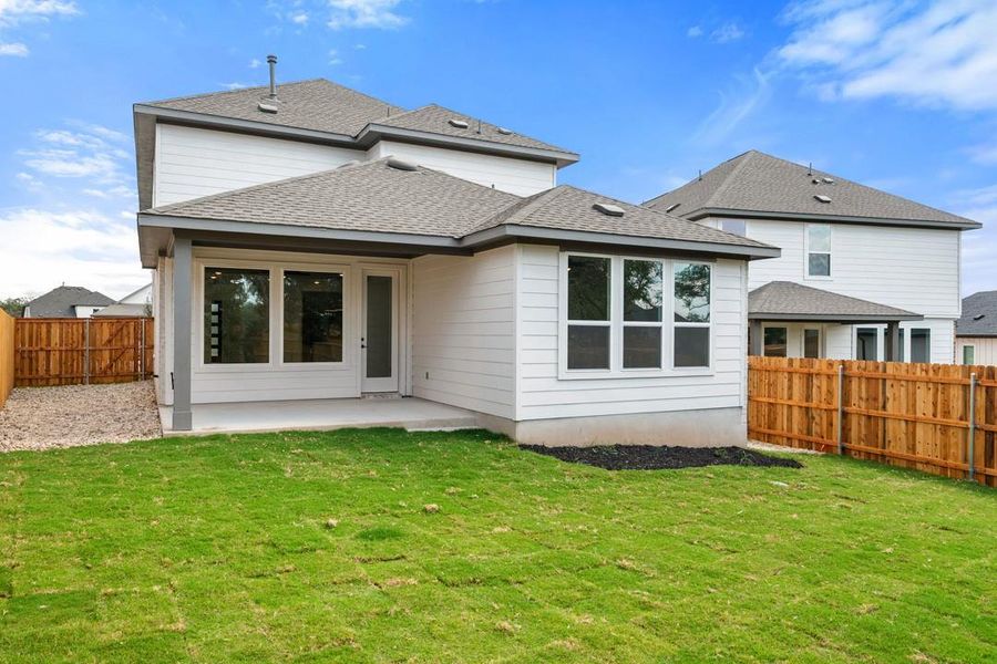 Exterior details and patio area of a home in Heritage, Dripping Springs (Image 25).