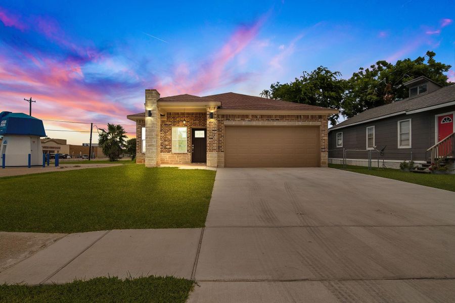 Front exterior of a new home in , Freeport, TX, highlighting curb appeal (Image 16).