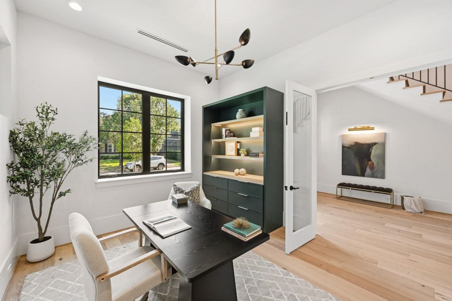 The office enjoys a commanding view of the front lawn and a gorgeous built-in!