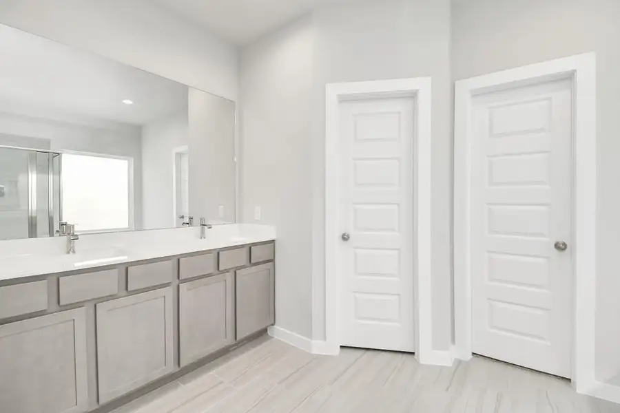 Experience luxury and relaxation in every detail. Sample photo of completed home with similar floor plan. Actual colors and selections may vary.