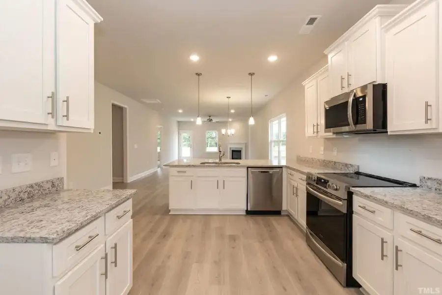 Furnished interior view inside a new home in East Lake, Leland (Image 3).