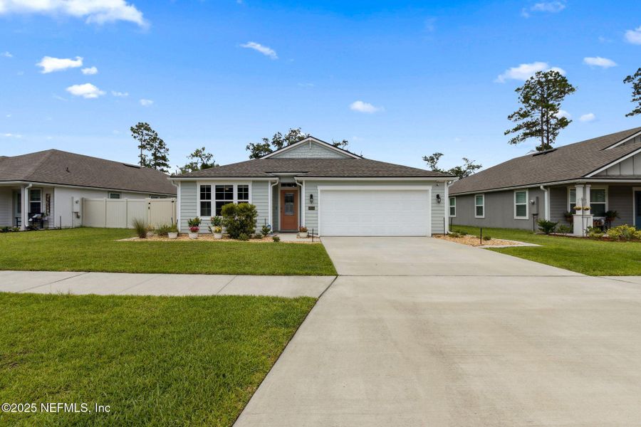 Front exterior of a new home in River Glen, Yulee, FL, highlighting curb appeal (Image 2). Front exterior of a new home in River Glen, Yulee, FL, highlighting curb appeal (Image 2).