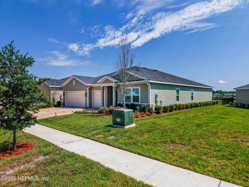 Front exterior of a new home in Granary Park, Green Cove Springs, FL, highlighting curb appeal (Image 25).