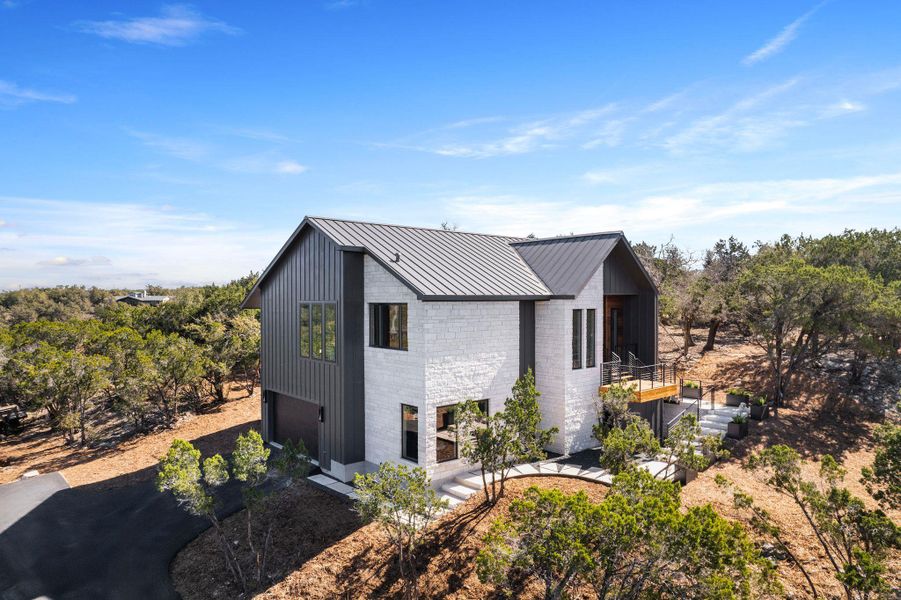 View of home's exterior with a standing seam roof and metal roof