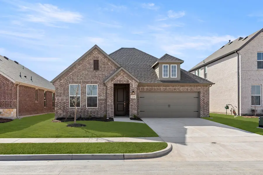 Representative exterior photo of a completed home built from the Liberty by Rockwell Homes in Wildflower Ranch, Fort Worth, TX (Image 1). Representative exterior photo of a completed home built from the Liberty by Rockwell Homes in Wildflower Ranch, Fort Worth, TX (Image 1).