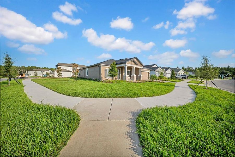 Front exterior of a new home in , Wesley Chapel, FL, highlighting curb appeal (Image 24). Front exterior of a new home in , Wesley Chapel, FL, highlighting curb appeal (Image 24).