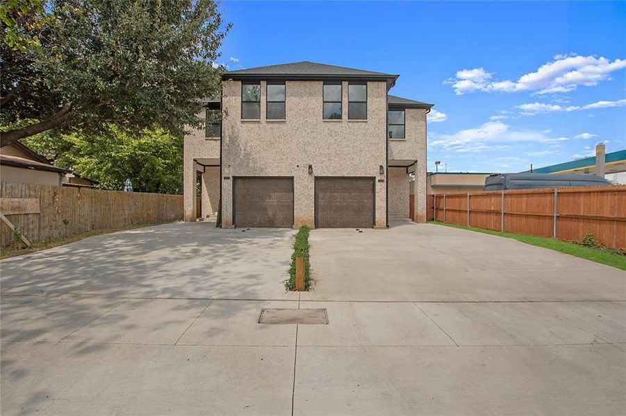 View of front of property featuring a garage