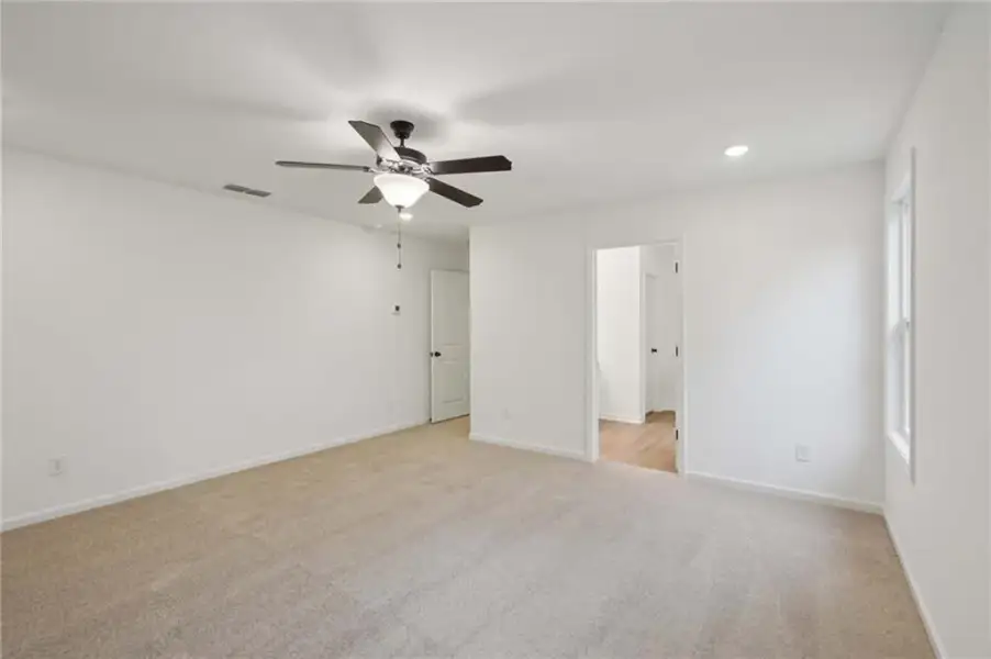 Spacious, unfurnished interior of a new home in Eastlyn Crossing, Flowery Branch (Image 25).