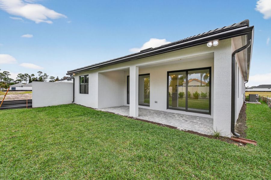 Exterior details and patio area of a home in Hendrix Reserve, Lake Worth (Image 29).