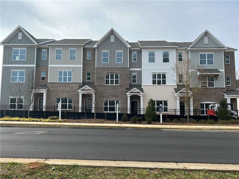 Front exterior of a new home in East Park Village, Kennesaw, GA, highlighting curb appeal (Image 2). Front exterior of a new home in East Park Village, Kennesaw, GA, highlighting curb appeal (Image 2).