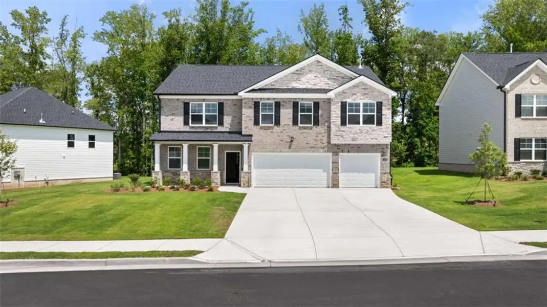 Front exterior of a new home in Independence, Loganville, GA, highlighting curb appeal (Image 2). Front exterior of a new home in Independence, Loganville, GA, highlighting curb appeal (Image 2).