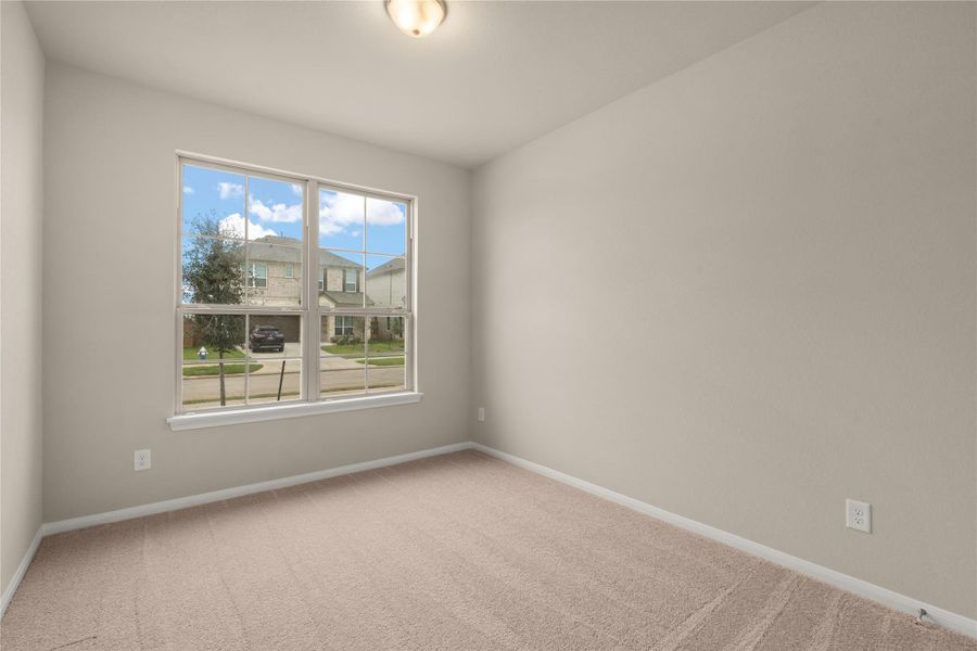 Your secondary bedroom features plush carpet, fresh paint, closet, and a large window that lets in plenty of natural lighting.