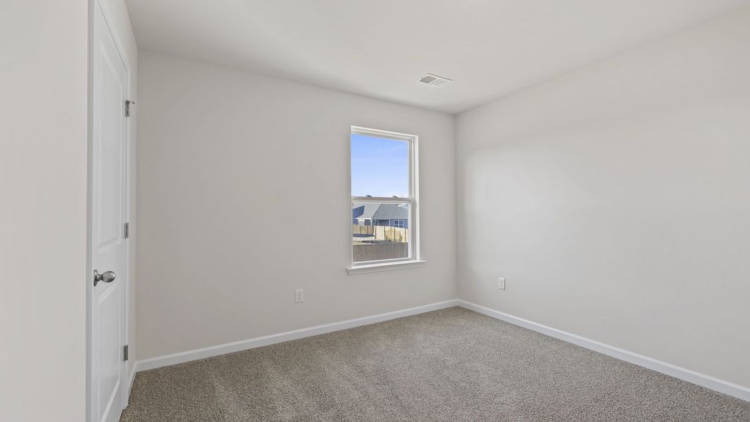 Spacious, unfurnished interior of a new home in Bentley Park, Greenwood (Image 23).