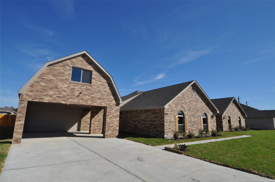 Front exterior of a new home in Pedregal, League City, TX, highlighting curb appeal (Image 25).