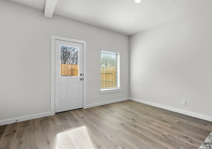 The dining room has large windows that let in great, natural light.