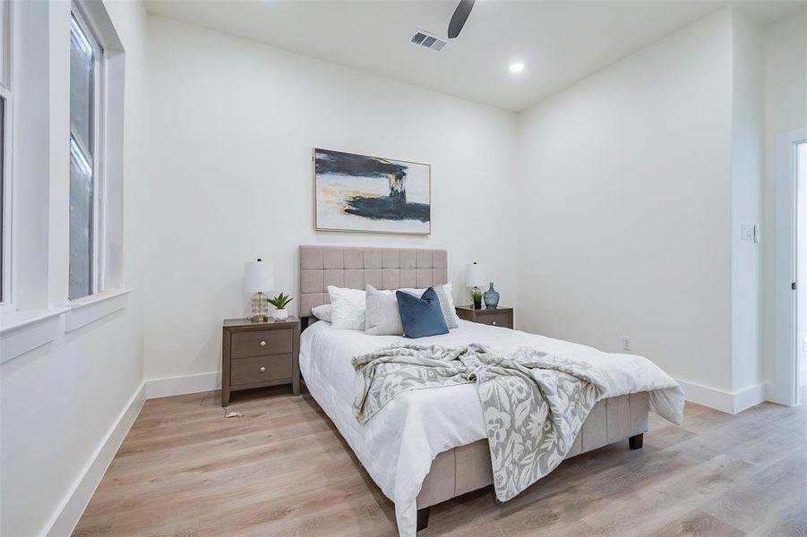 Bedroom featuring light wood-type flooring and ceiling fan