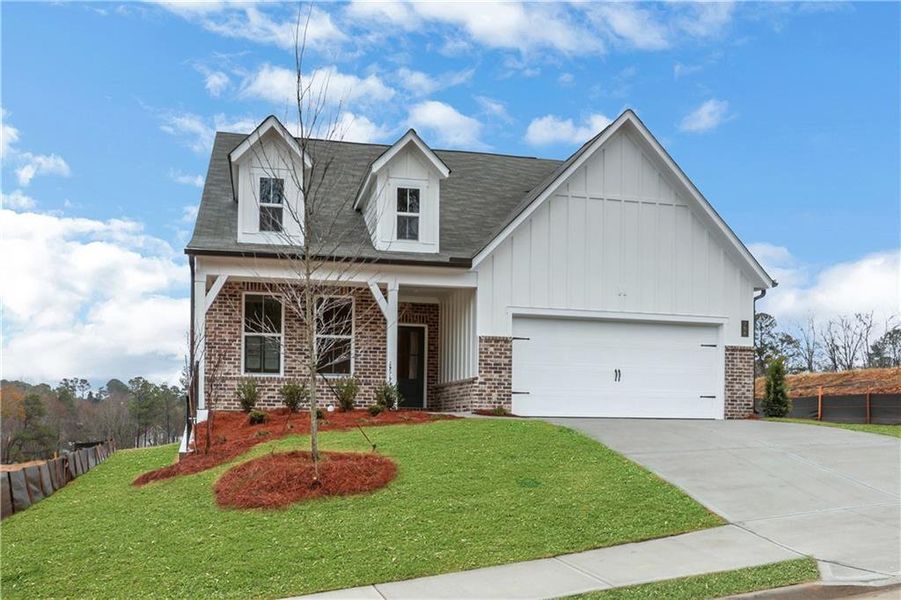 Front exterior of a new home in Cambridge at Steels Bridge, Canton, GA, highlighting curb appeal (Image 1). Front exterior of a new home in Cambridge at Steels Bridge, Canton, GA, highlighting curb appeal (Image 1).