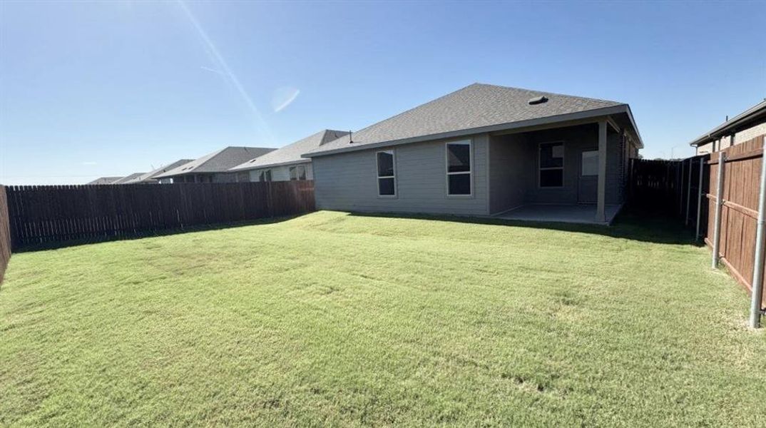 Exterior details and patio area of a home in Monarch at the Meadows, Ponder (Image 2).