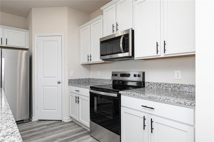 Furnished interior view inside a new home in Conners Landing at Mirror Lake, Villa Rica (Image 9).