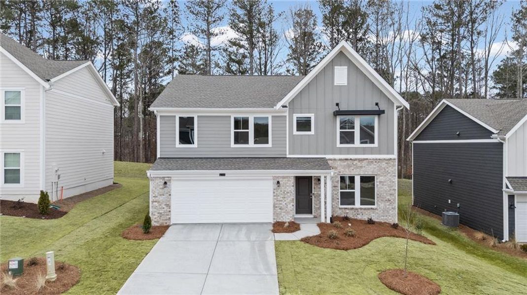 Front exterior of a new home in Sage Woods, Dallas, GA, highlighting curb appeal (Image 19).