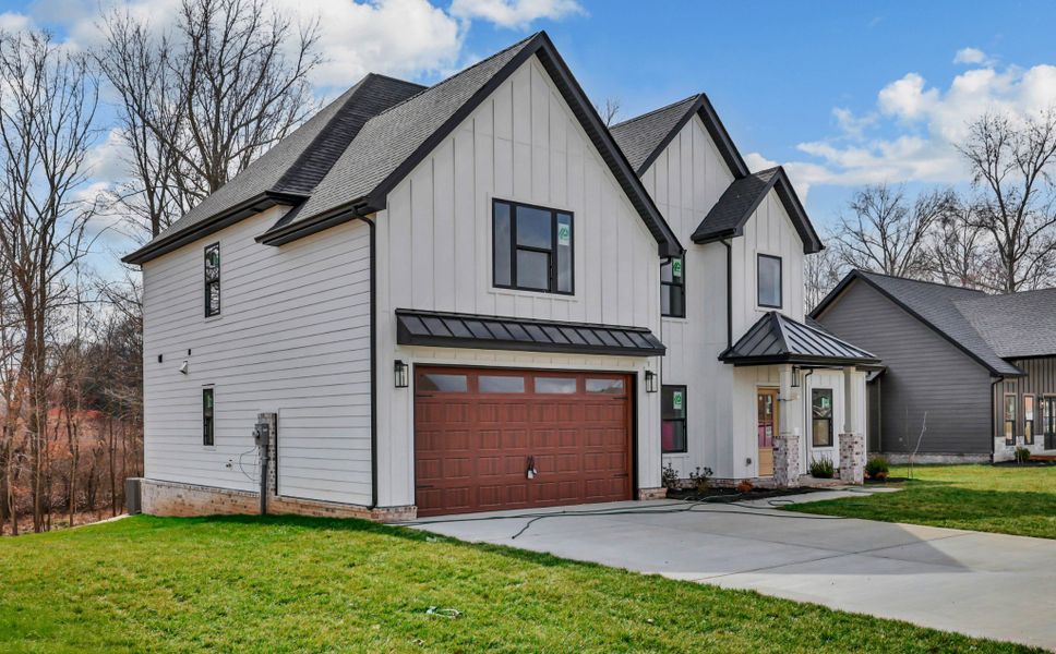 Front exterior of a new home in Bellshire, Clarksville, TN, highlighting curb appeal (Image 14). Front exterior of a new home in Bellshire, Clarksville, TN, highlighting curb appeal (Image 14).