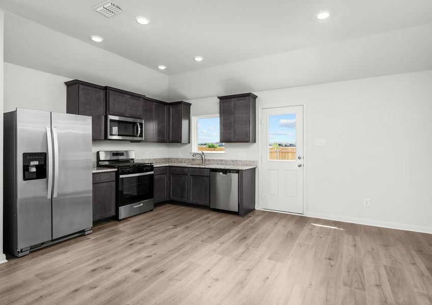 The dining area sits adjacent to the kitchen in the Ash.