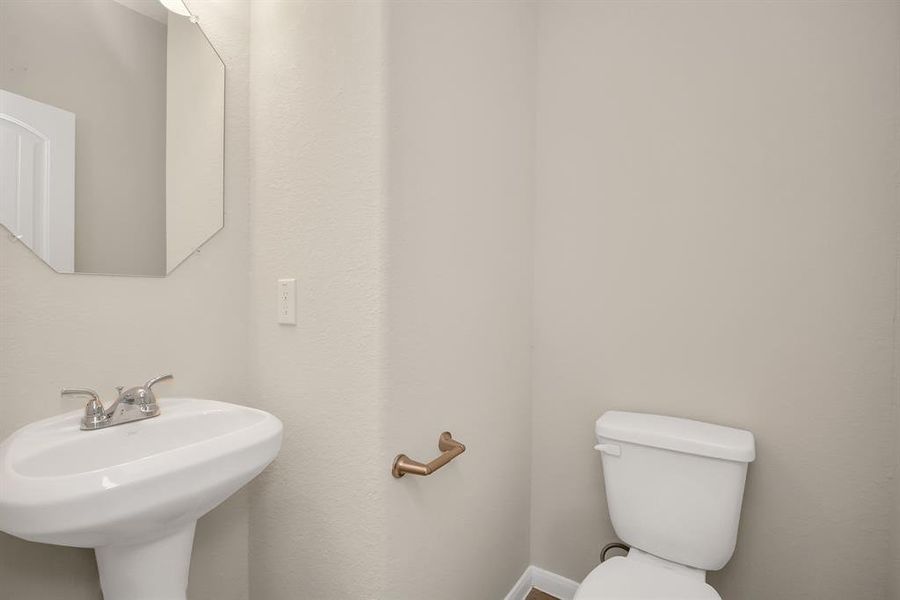 Imagine unwinding in this beautiful half bath after a long day! *This image is from another Saratoga Home with similar floor plan and finishes, not the Brittany floorplan.*