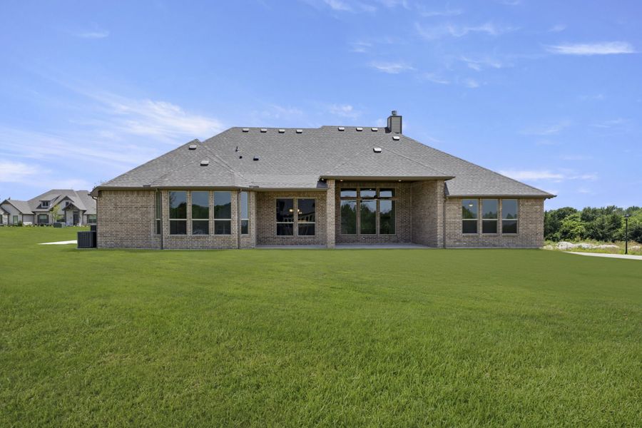 Front exterior of a new home in The Meadows, Gunter, TX, highlighting curb appeal (Image 26). Front exterior of a new home in The Meadows, Gunter, TX, highlighting curb appeal (Image 26).