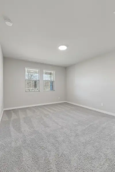 Primary Suite in the Holden home plan by Trophy Signature Homes – REPRESENTATIVE PHOTO