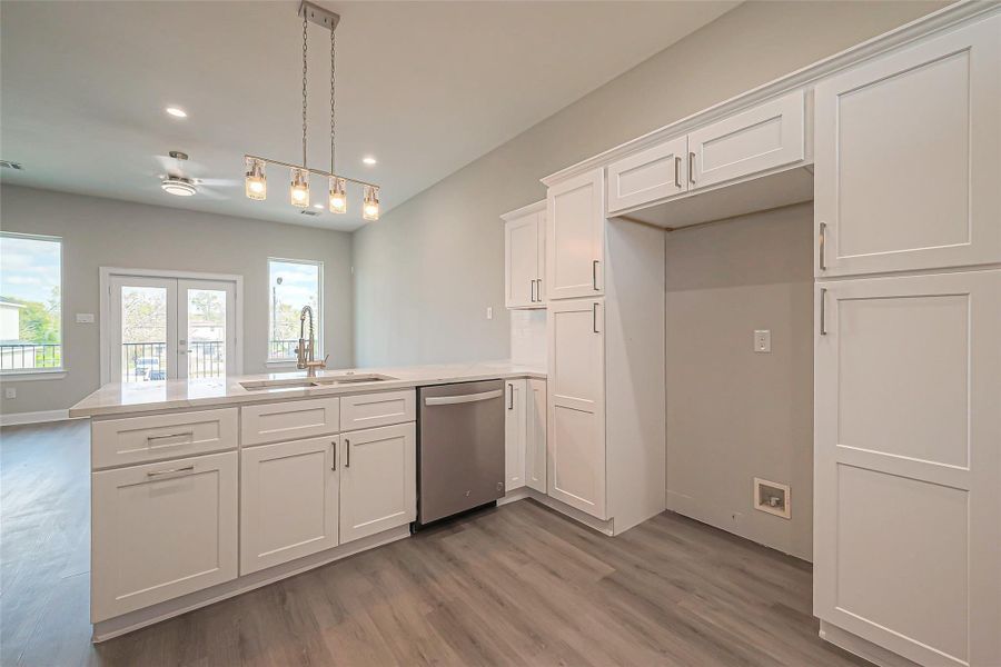 Unit 2: Kitchen peninsula open to living area.