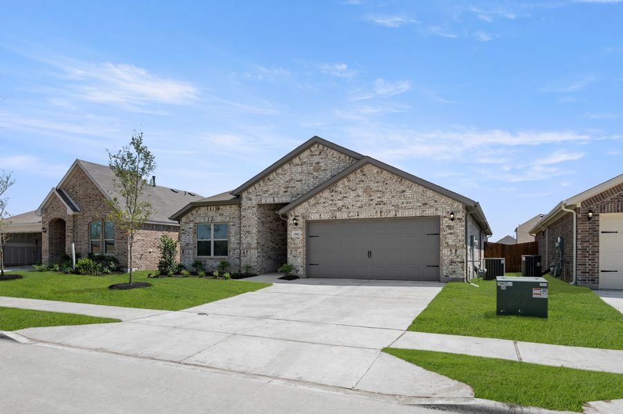 Front exterior of a new home in Terra Vella, Haslet, TX, highlighting curb appeal (Image 2). Front exterior of a new home in Terra Vella, Haslet, TX, highlighting curb appeal (Image 2).