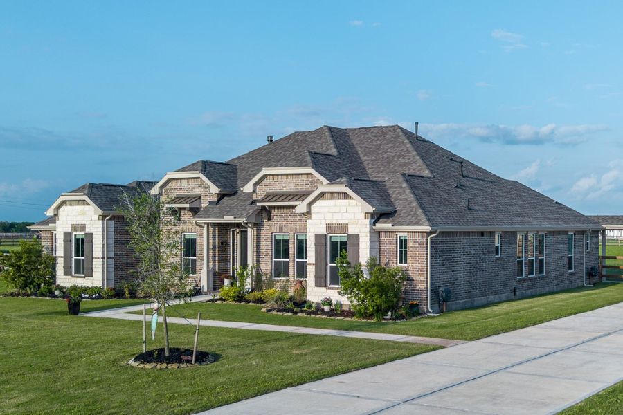 Front exterior of a new home in Lakeview, Waller, TX, highlighting curb appeal (Image 22).